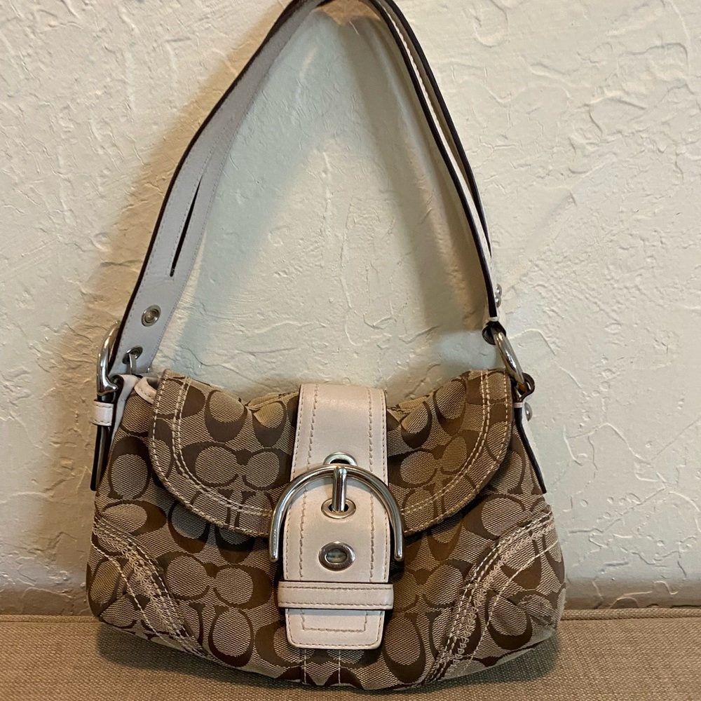 Brown and cream Coach purse